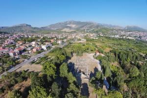 an aerial view of a city with mountains in the background at Apartments for families with children Solin, Split - 21472 in Solin