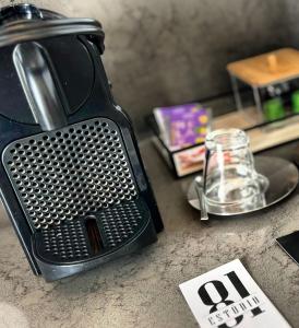 a tea kettle sitting on a counter next to a sink at ESTÚDIO 81 junto à Sinagoga in Tomar