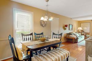 a dining room with a table and chairs at Driftwood Villa - 240 in Edisto Island