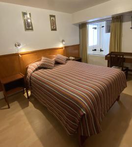 Rúm í herbergi á Saphi Inn Cusco - Excelente ubicación