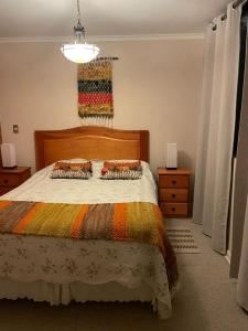 Ένα ή περισσότερα κρεβάτια σε δωμάτιο στο Departamento Condominio Parque del Volcan