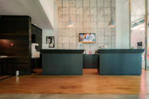 a room with two counters in a room with wood floors at Campanile Casablanca Centre Ville in Casablanca