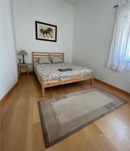 En eller flere senge i et værelse på Casa da Avó Lídia