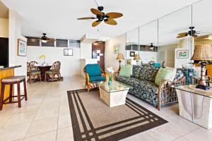 a living room with a couch and a table at Royal Kahana 1212 in Kahana