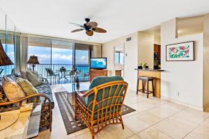 a living room with a view of the ocean at Royal Kahana 1212 in Kahana