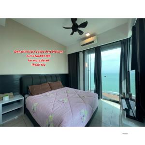 a bedroom with a bed and a ceiling fan at D Wharf Port Dickson Private Condo Waterfront in Port Dickson