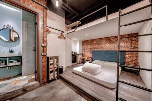 Rúm í herbergi á Hotel Leisure Chiayi