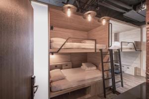 Rúm í herbergi á Hotel Leisure Chiayi