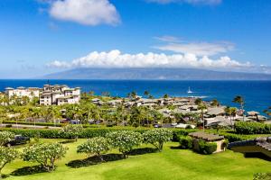 a view of a resort with the ocean and buildings at Kapalua Ridge Villa 2622 in Kahana