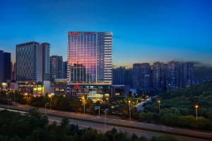 a city skyline at night with a tall building at Zhuzhou Marriott Hotel in Zhuzhou