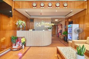 a lobby of a store with a reception counter at Bin Bin 10 - Mimosa Hotel Near Tan Son Nhat Airport in Ho Chi Minh City