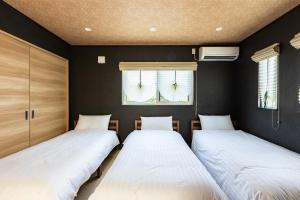 Tempat tidur dalam kamar di HP House Shirahama
