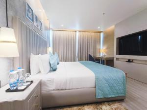 Postel nebo postele na pokoji v ubytování Mariton Hotel