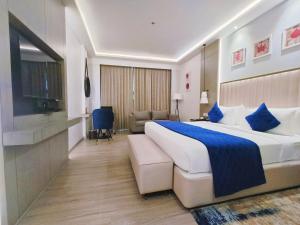 Postel nebo postele na pokoji v ubytování Mariton Hotel