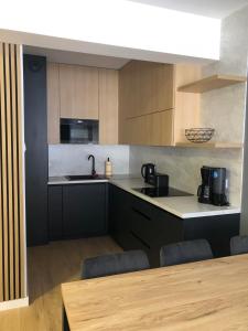 Kuchyň nebo kuchyňský kout v ubytování Apartamenty Ewa