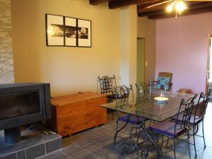 a living room with a table and a television at Guestroom Xivry-Circourt, 1 pièce, 2 personnes - FR-1-584-206 