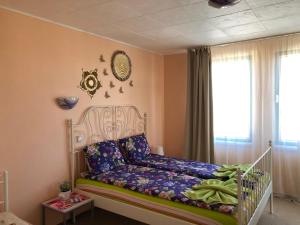 a childs bedroom with a crib in a room at Apartment Terrace under the stars in Primorsko
