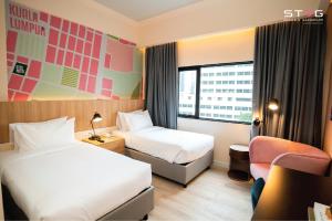 Postel nebo postele na pokoji v ubytování STEG Kuala Lumpur + 37 fotografií