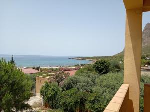 a view of the ocean from a house at Il Rustico di Pino in Custonaci