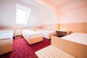 Postel nebo postele na pokoji v ubytování Hotel Pivovar
