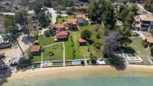 an aerial view of a house on the beach at Villa Egeo - Beachfront Paradise, Starlink, BBQ in Vourvourou