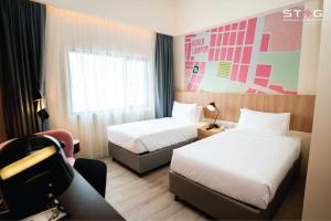 Postel nebo postele na pokoji v ubytování STEG Kuala Lumpur