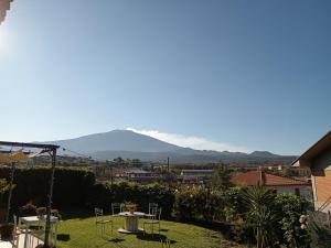 a view of mt kilimanjaro from the garden of a house at Good Morning Etna in Bronte