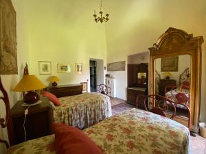 Postel nebo postele na pokoji v ubytování Palazzo Ronchelli