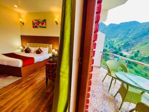 a hotel room with a bed and a balcony at Hotel Kempty - A Boutique Hotel, Mussoorie in Mussoorie