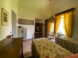 Postel nebo postele na pokoji v ubytování Palazzo Ronchelli