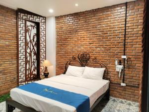 Ένα ή περισσότερα κρεβάτια σε δωμάτιο στο Mộc An - ngõ 89 Đàm Quang Trung, Long Biên - by Bay Hostel
