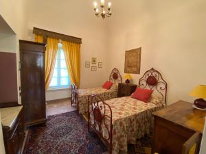 Postel nebo postele na pokoji v ubytování Palazzo Ronchelli