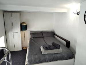 a bedroom with a bed with two pillows on it at elefant in Baia Mare