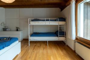 Postel nebo postele na pokoji v ubytování Jungfrau-View Apartment, terrace & free parking
