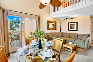 a living room with a couch and a table at Kihei Sands B2 in Kihei