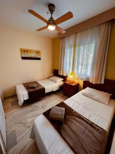 Ένα ή περισσότερα κρεβάτια σε δωμάτιο στο Crown Apartments with Sea View +21 φωτογραφίες