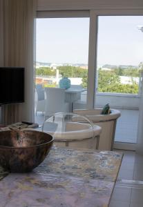 a living room with a bowl on a table at Suite Luxury Seaview in Misano Adriatico