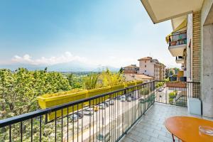 a balcony with a view of a city at Casa Lungogesso in Cuneo