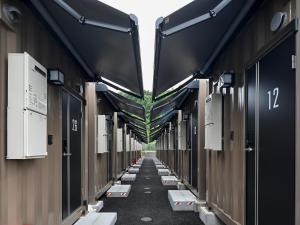 a row of train cars lined up in a hallway at HOTEL R9 The Yard Kasai in Kasai