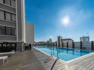 a swimming pool on the roof of a building at Hyatt Regency Naha, Okinawa in Naha