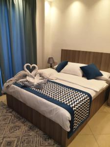 A bed or beds in a room at Sharm Hills