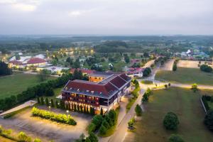 an aerial view of a building in a town at Aquarell Hotel in Cegléd