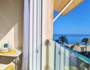 a balcony with a view of the ocean at ESTEPONA RADA BEACH ABC APARTMENTS & ESTUDIOS A in Estepona