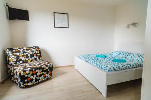 Postel nebo postele na pokoji v ubytování Apartmány Špička - Stříbrnice u sjezdovky