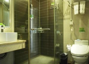 a bathroom with a shower and a toilet and a sink at Morninginn, Yanling Jinggang Road in Ling