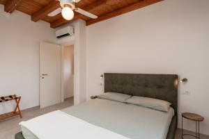 En eller flere senger på et rom på Casale Pisano