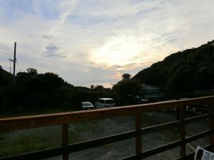 a view of a road with two rvs parked on it at Shirahama Meiji Villa in Shirahama