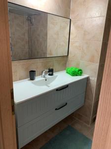 a bathroom with a sink and a mirror at על שפת כנרת in Tiberias +10 photos