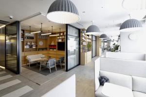 a lobby of a store with a table and chairs at Shinagawa Prince Hotel in Tokyo