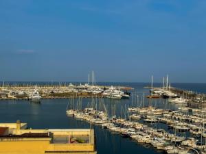a bunch of boats are docked in a harbor at Mansarda vista mare in Imperia